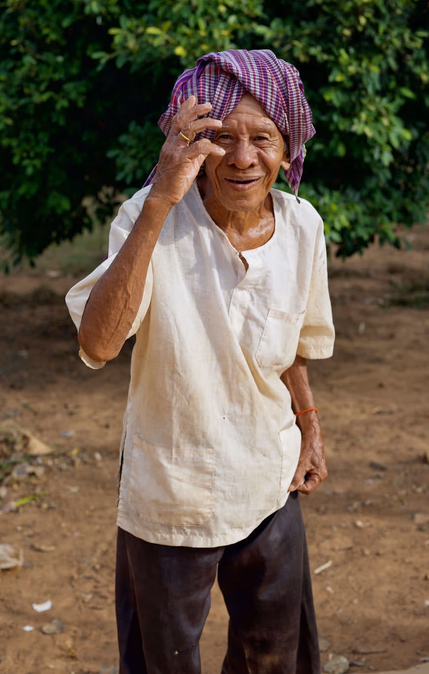 Khmer temple caretaker with headscarf