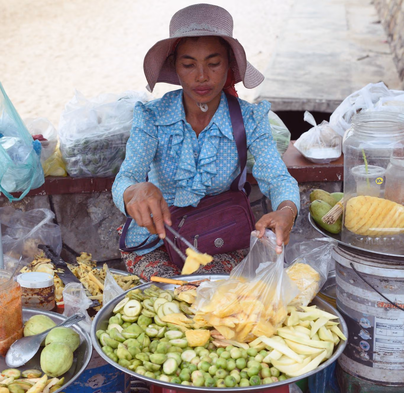 Lady at her fruit stand in Cambodia