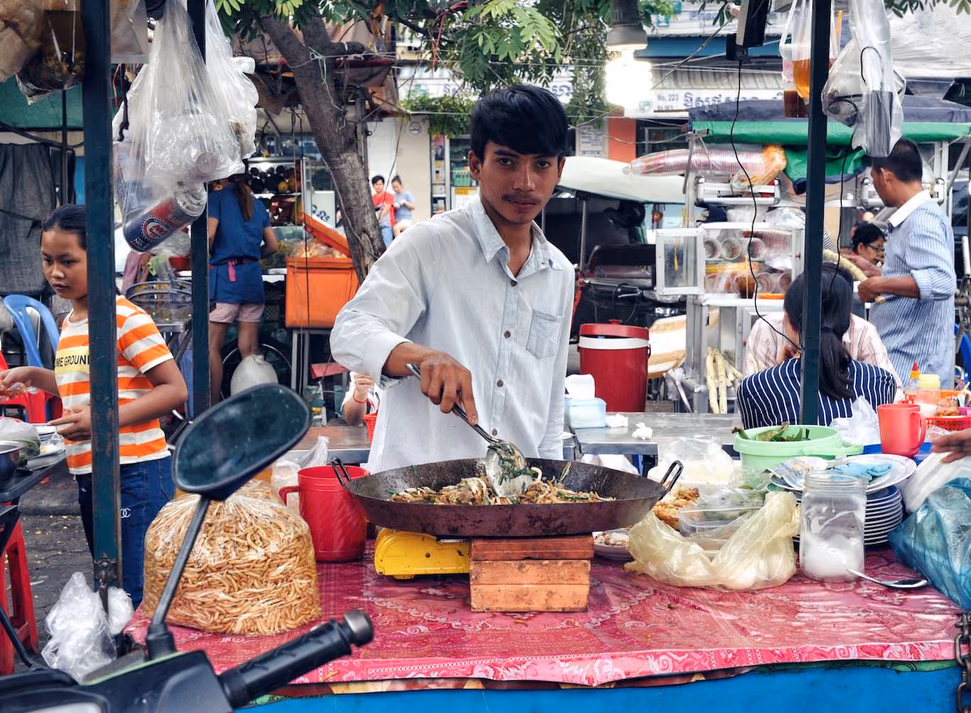 Man cooking Cambodian street food