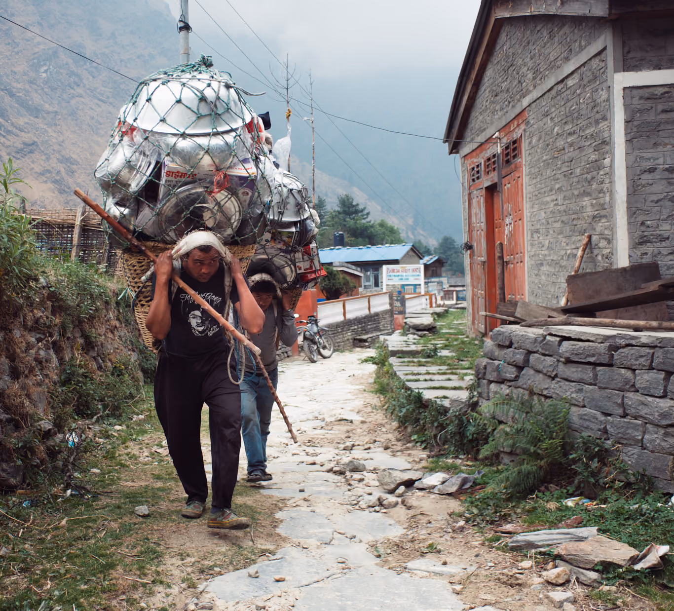 Nepalese porters carrying a very heavy load