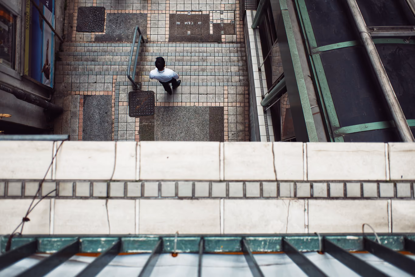 Overhead view of a man on the stairs in Hong Kong