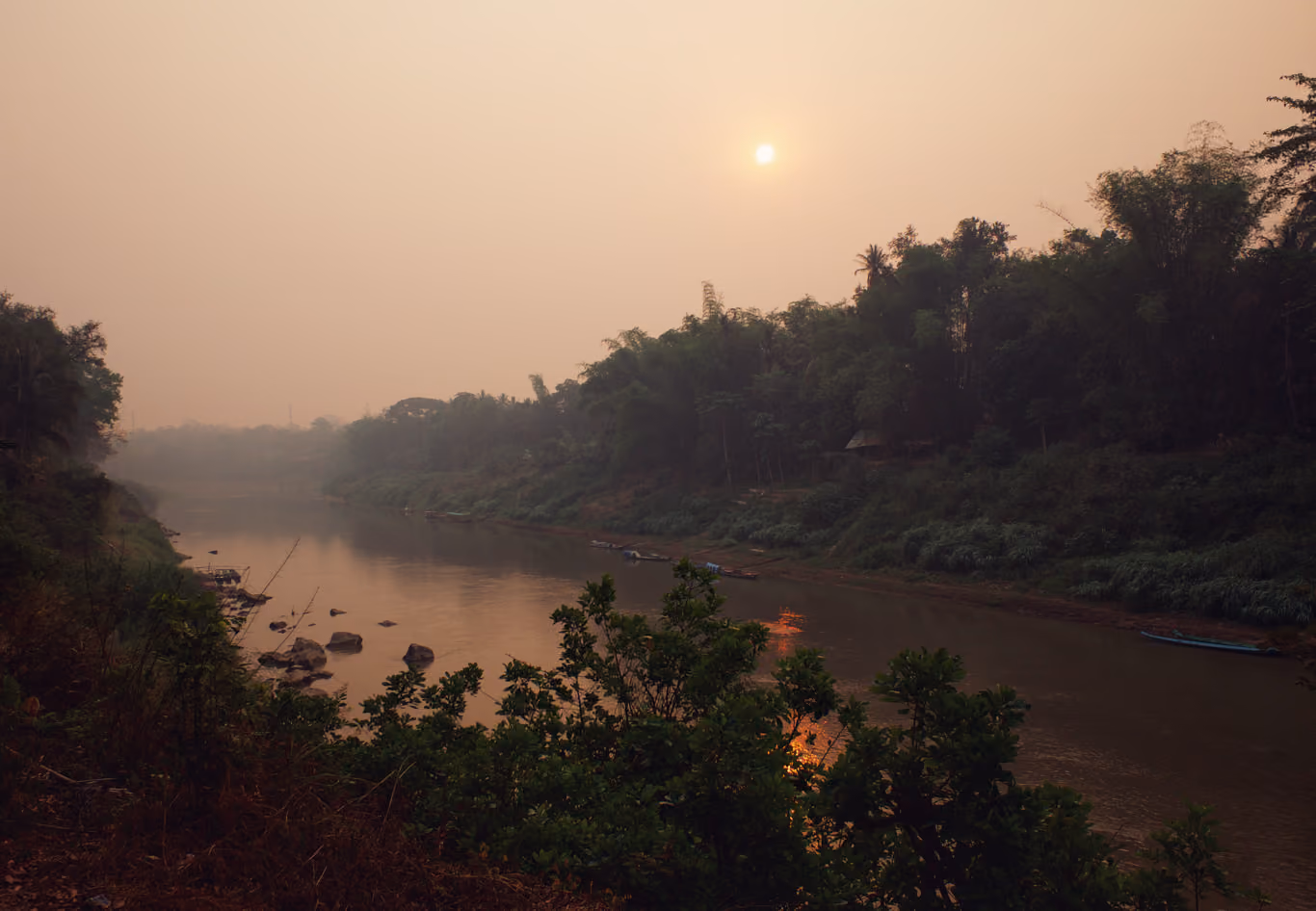 Smoky sunrise on the Mekong River near Luang Prabang, Laos
