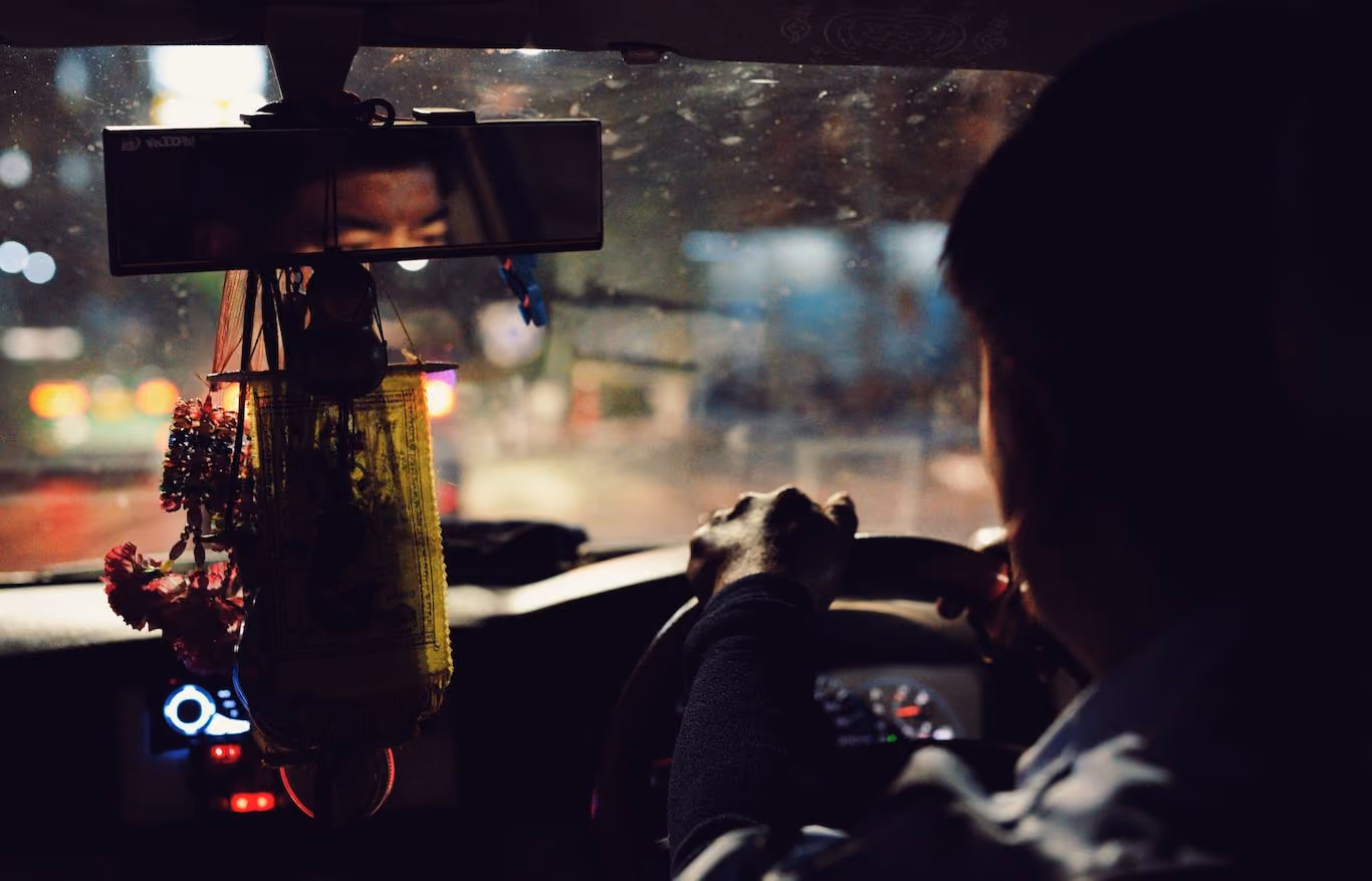 Taxi driver from back seat in SE Asia